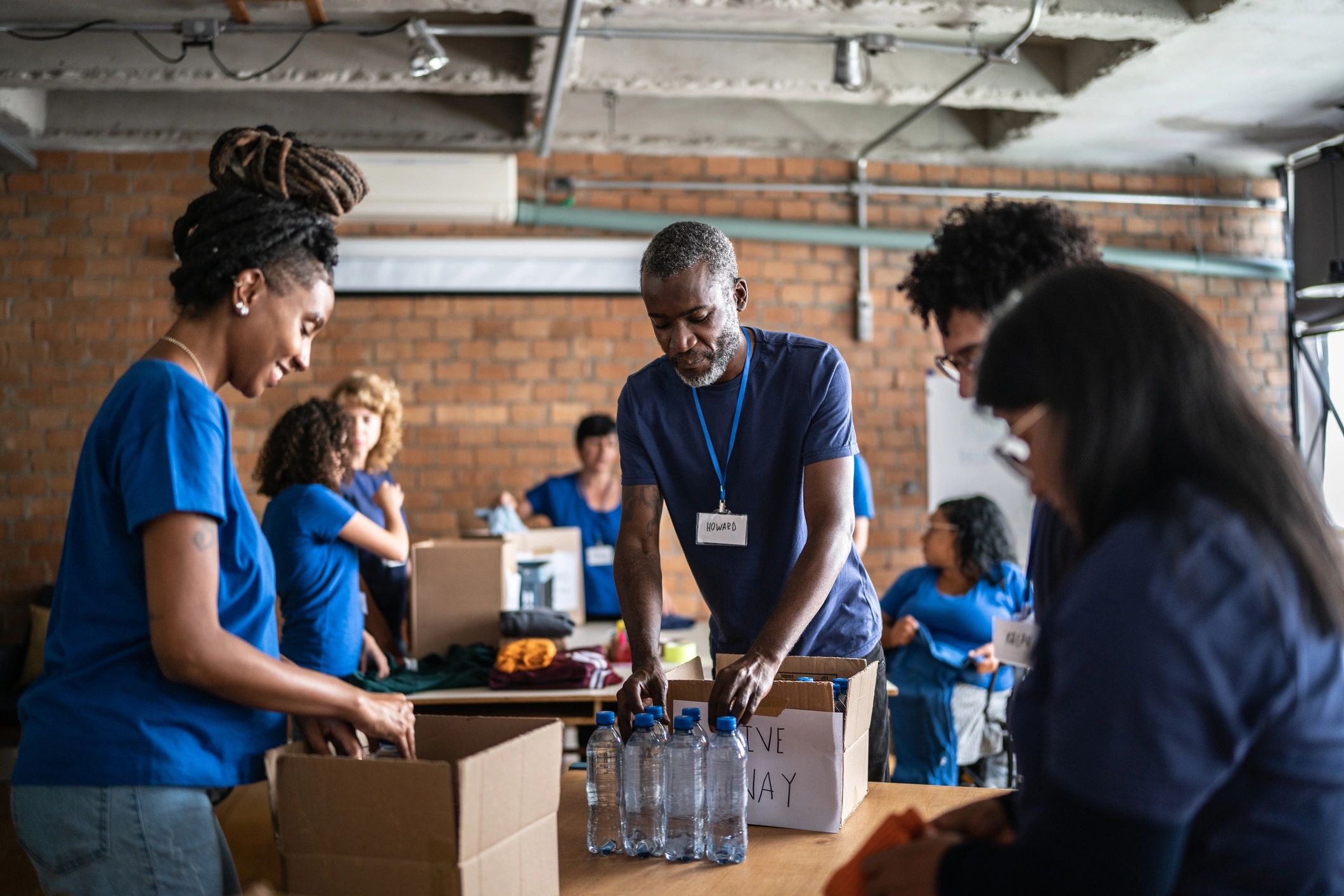 Volunteers collaborating at a community center table